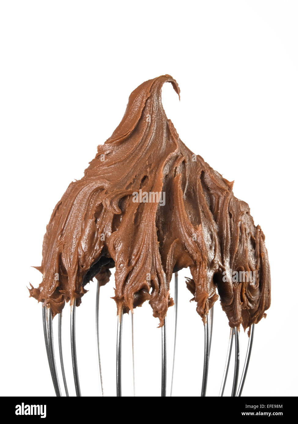 Kitchen whisk with Chocolate isolated on a white background Stock Photo