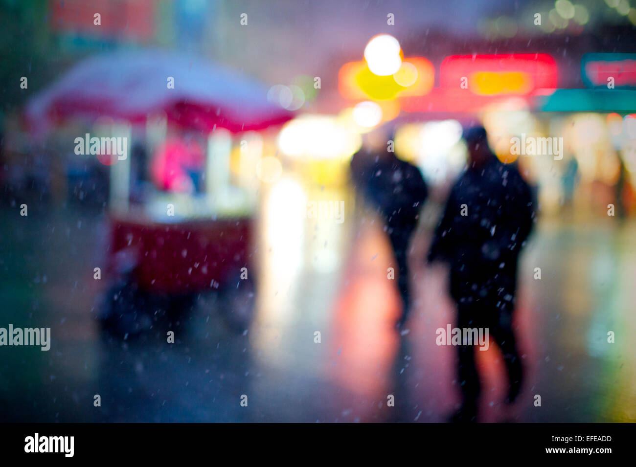 Locals in Taksim square during a snow storm as part of a photo essay on winter breaks in Istanbul, Turkey. Stock Photo