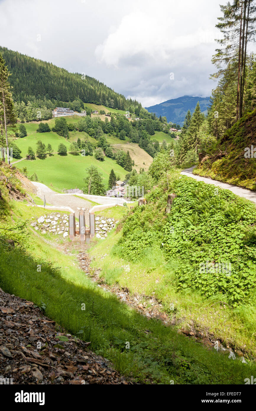 Flood prevention measures next to the path to the top of the Schmittenhöhe Zell am See Austria in summer Stock Photo