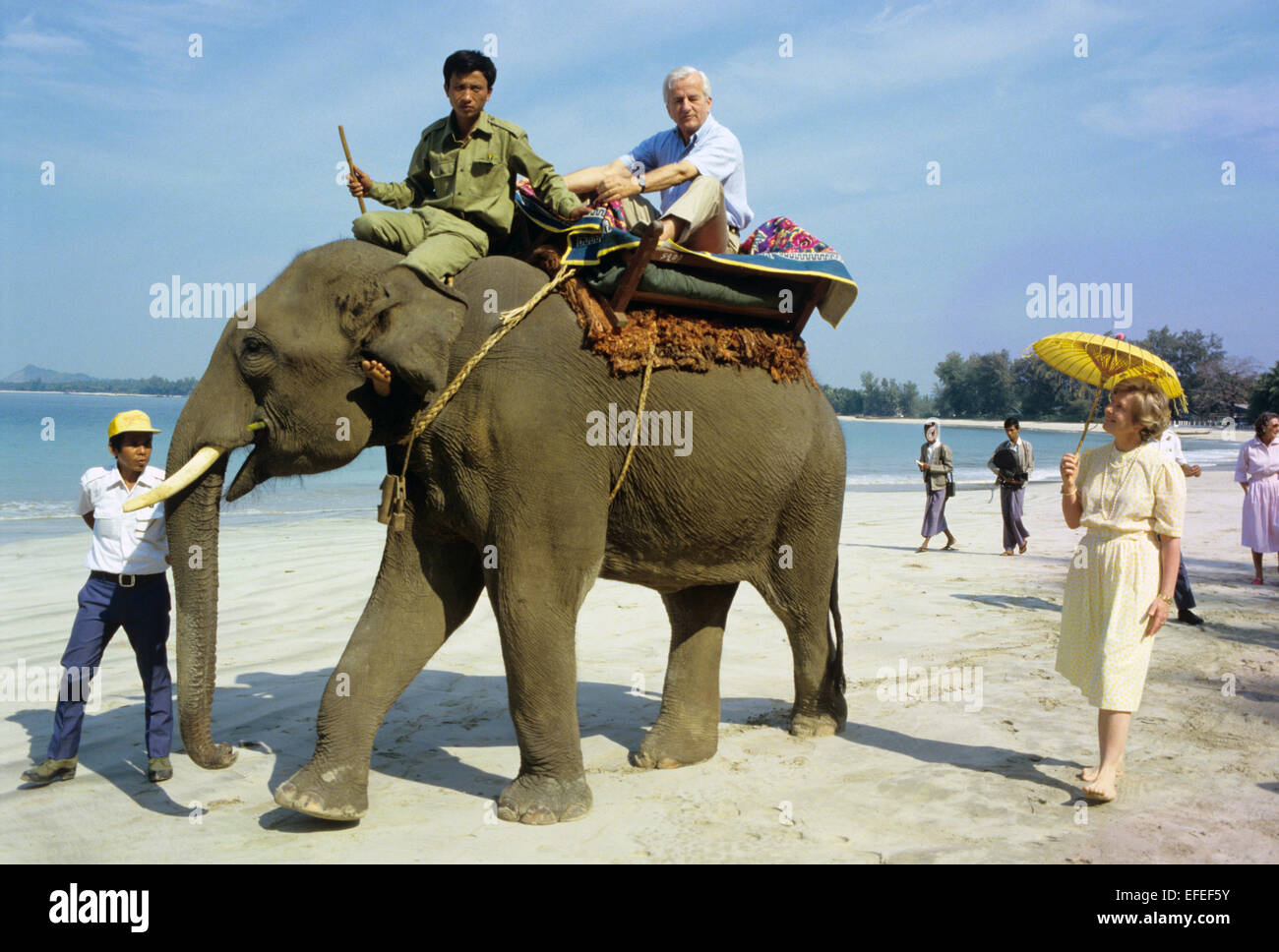 FILE - A file picture dated 10 February 1986 shows the late former German President Richard von Weizsaecker riding an elephant on the beach in Sandoway, Myanmar. To the right his wife Marianne stands with a yellow umbrella. Von Weizsaecker died on 30 January 2015 at the age of 94. Photo: MARTIN ATHENSTAEDT/dpa Stock Photo