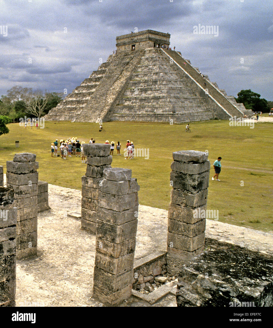Mexico - Chichen Itza on of the best known sites. with well preserved and restorded buildings This is the famous view of the Castillo across the Thousand Columns from the Temple of the Warriors Stock Photo