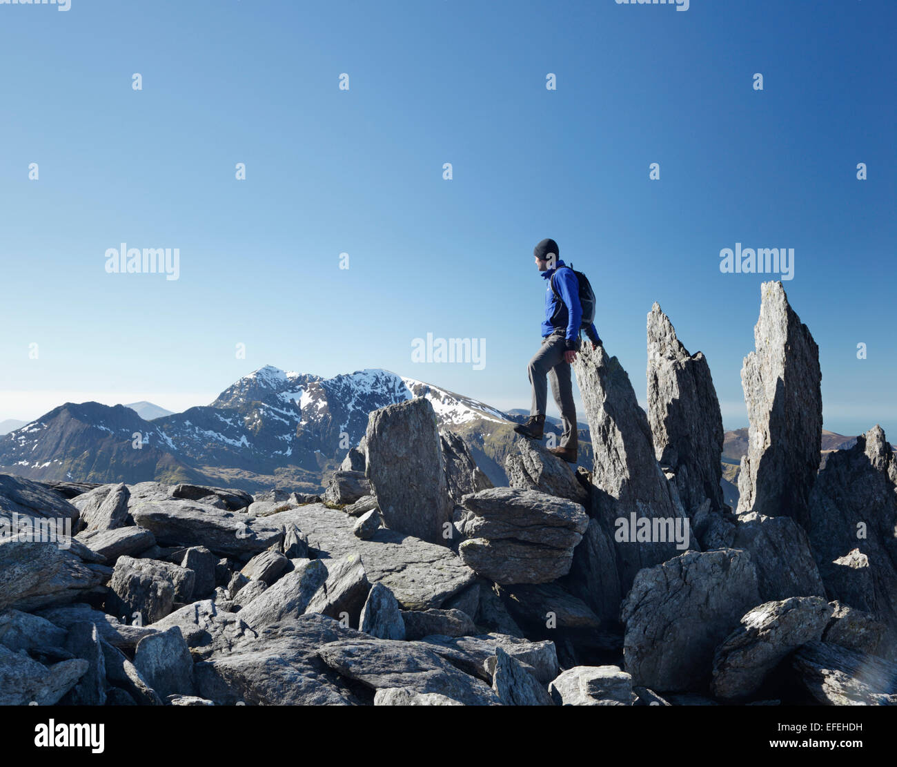 Hillwalker on Glyder Fawr looking towards Mt Snowdon in the distance. Snowdonia National Park. Gwynedd. Wales. UK. Stock Photo