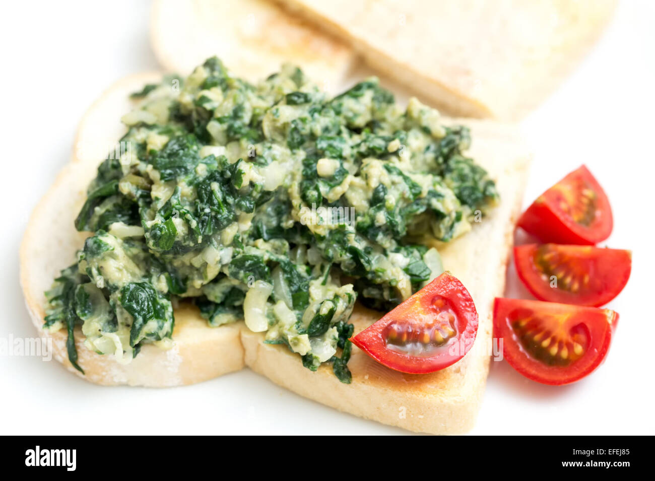 Scrambled egg with spinach, onion and basil. Italian style uova