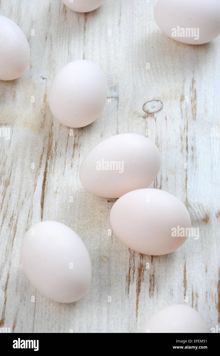 White eggs on a wooden background Stock Photo