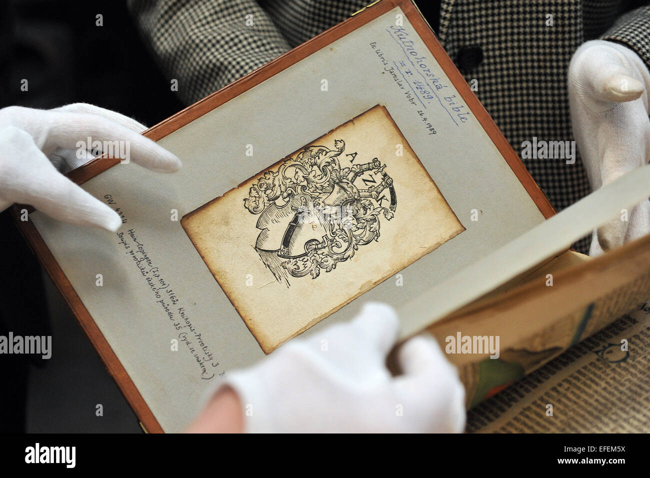 Culture Minister Daniel Herman hands Kutna Hora Bible, a rare incunabula from 1489 and the second complete edition of the Bible printed in Bohemia, over to Moravian Land Library. Bible is pictured in Brno, Czech Republic, February 2, 2015. (CTK Photo/Vaclav Salek) Stock Photo