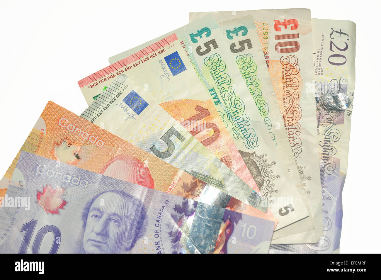 British Pound notes, Canadian Dollar notes and European Euro notes photographed against a white background. Stock Photo