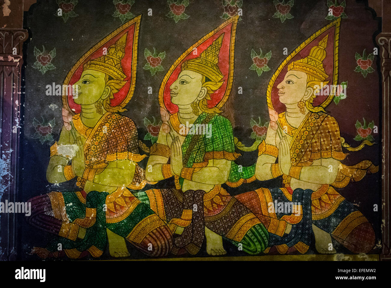 Thai temple mural on the wall of the famous Wat Phra Si Rattana Mahathat in Phitsanulok, Thailand. Stock Photo