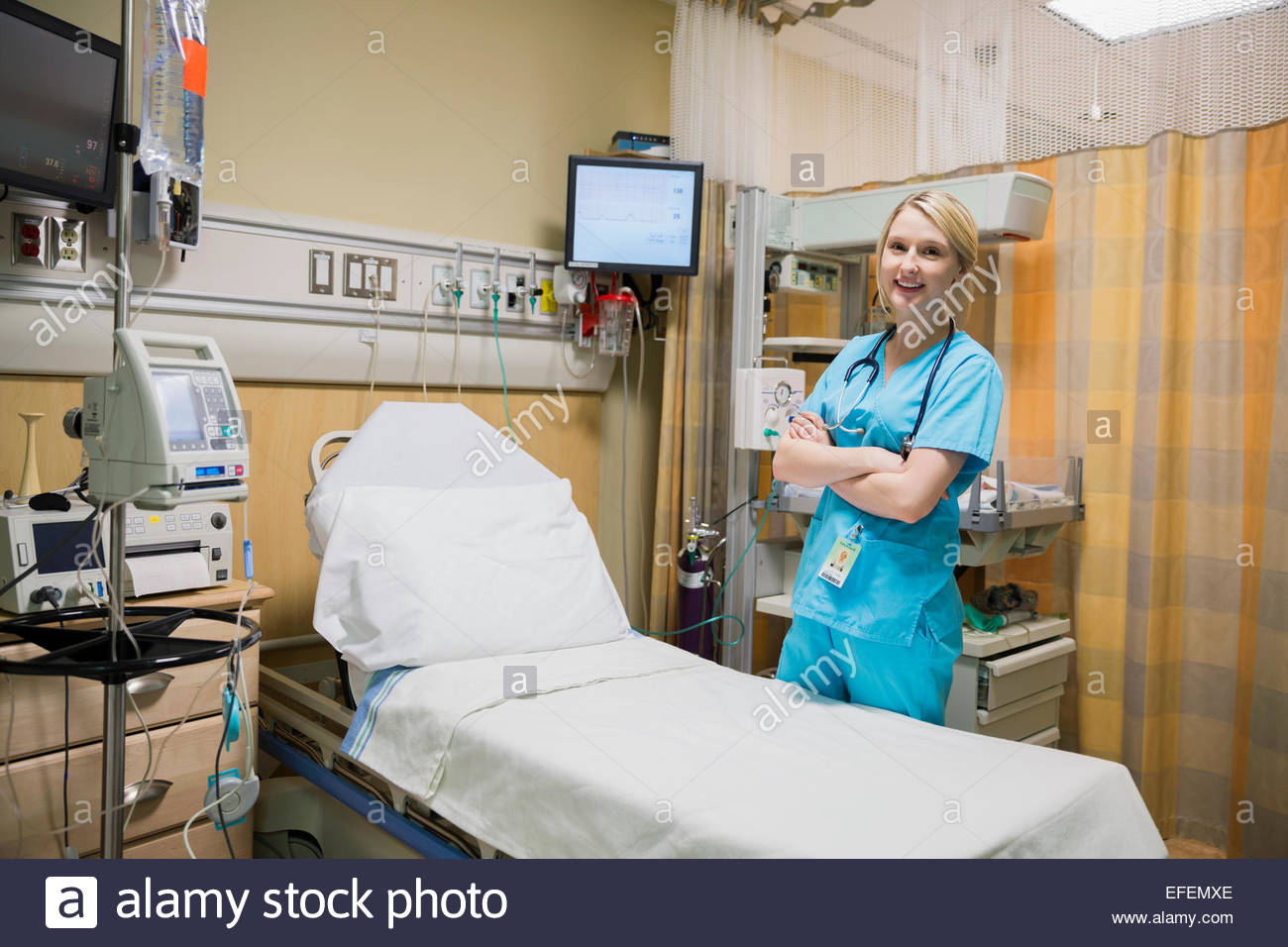 Portrait smiling nurse arms crossed hi-res stock photography and images ...