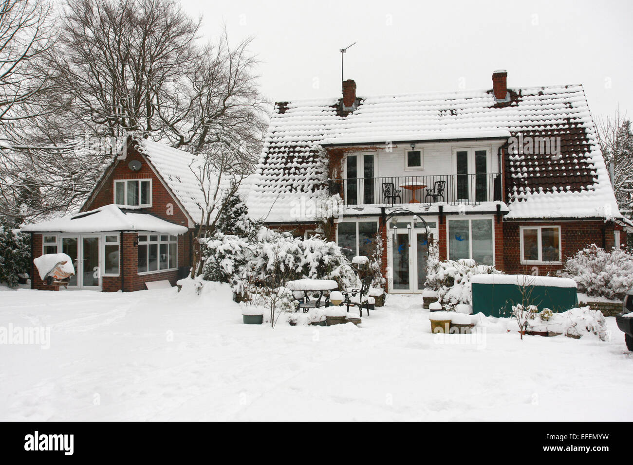 Snow covered residental house and garden in Bordon Hampshire in 2009. Stock Photo