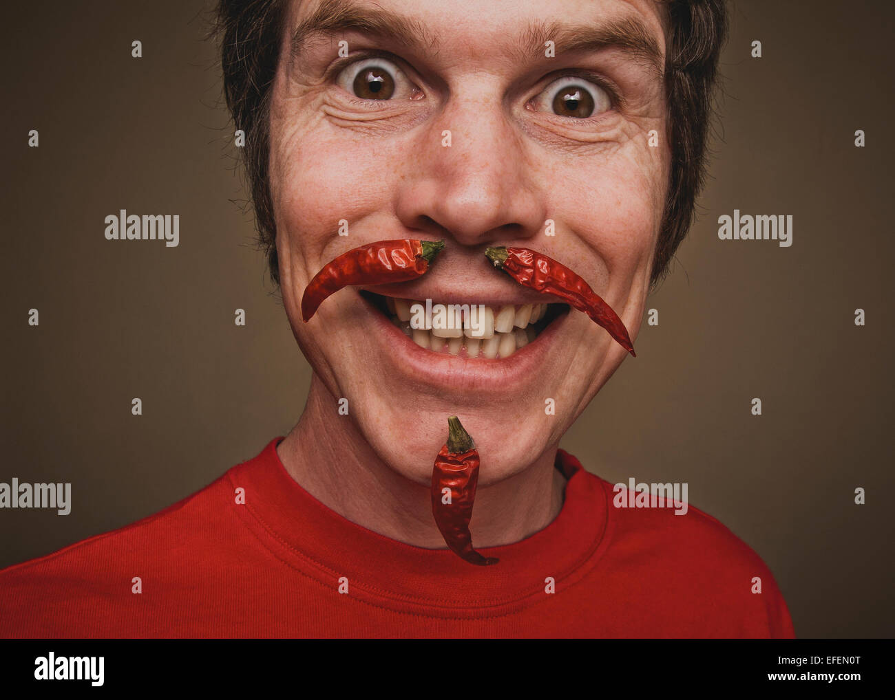 close up of a man with chillie pepper beard and moustache chile chilly Stock Photo