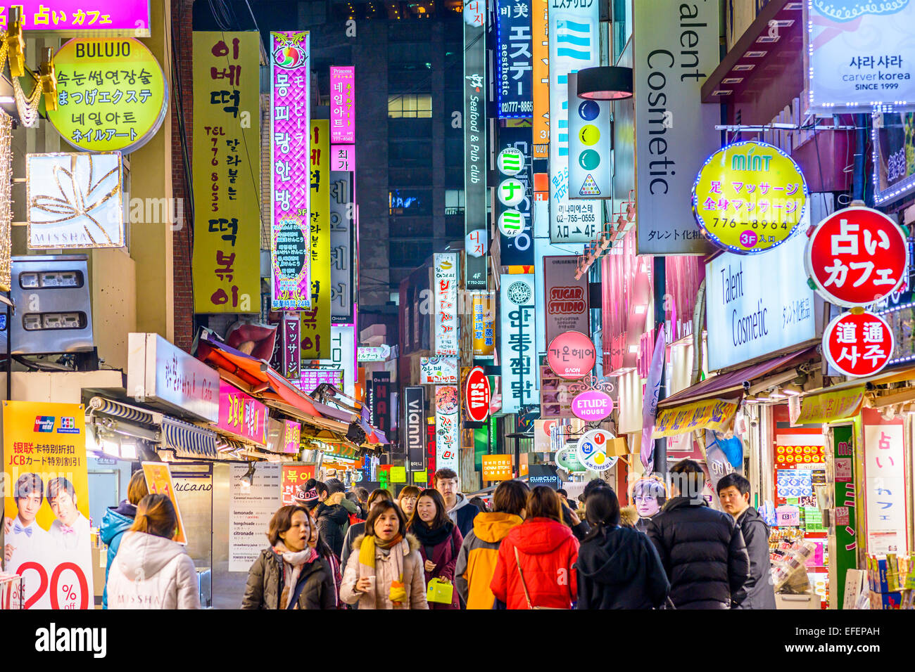 Crowds enjoy the Myeong-Dong district nightlife in Seoul. Stock Photo