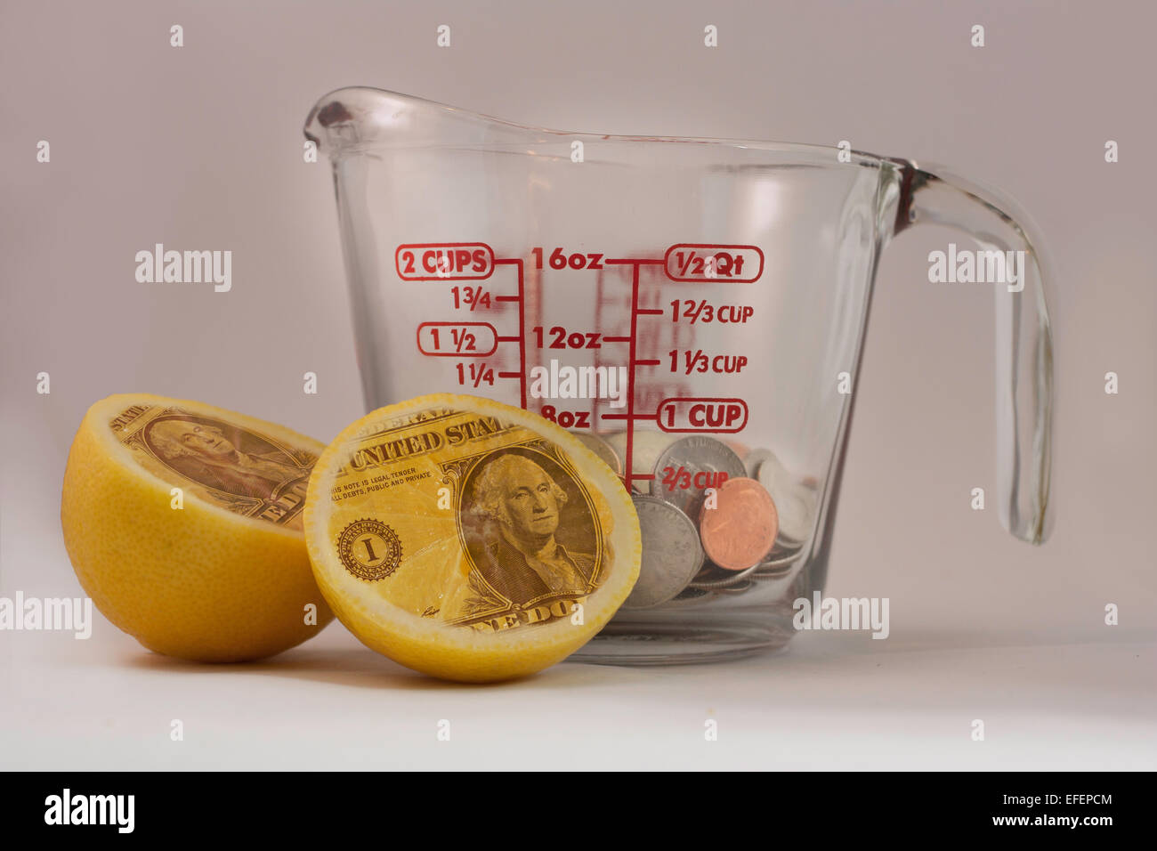 Measuring cup filled coins lemons hires stock photography and images