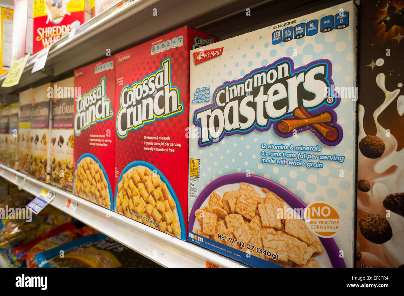 Boxes of MOM Brands (formerly Malt-O-Meal) sugary breakfast cereals in a supermarket in New York on Tuesday, January 27, 2015. Post Holdings whose brands include Grape Nuts and Raisin Bran is buying MOM Brands, manufacturer of iconic cereals such as Marshmallow Mateys and Golden Puffs in a deal worth $1.15 billion. The acquisition gives Post and 18 percent share of the breakfast cereal market after Kellogg's at 32% and General Mills at 31%. (© Richard B. Levine) Stock Photo