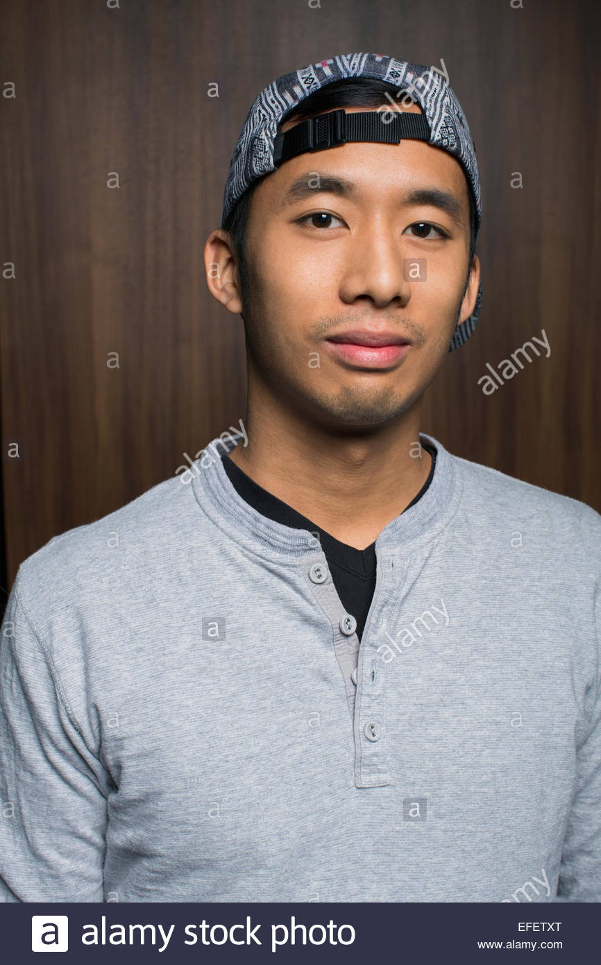 Portrait of smiling man wearing backward baseball cap Stock Photo