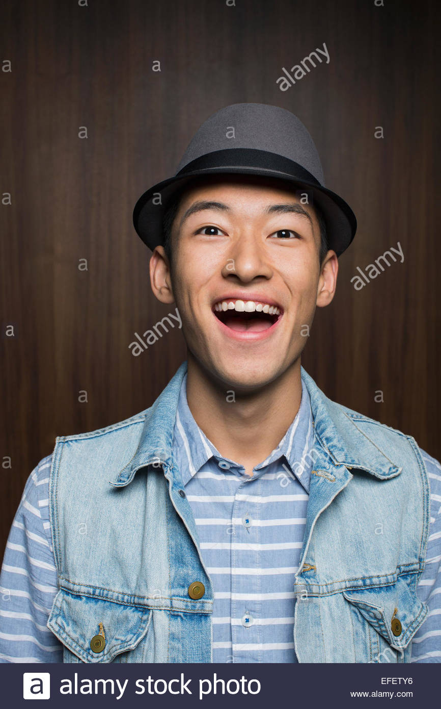 Portrait of surprised man wearing fedora Stock Photo