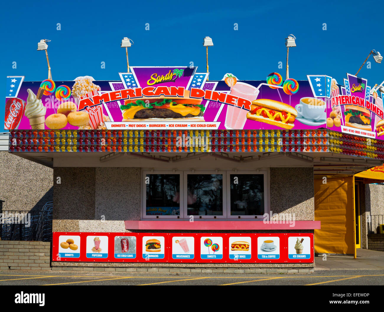 Brightly coloured American style Diner selling burgers drinks and fast food products in Barmouth North Wales UK Stock Photo