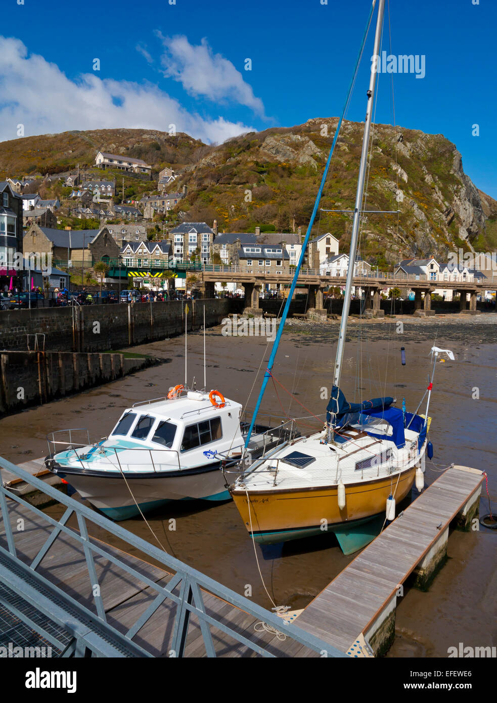Boats moored in the harbour at Barmouth a popular seaside resort in Gwynedd in North Wales UK at the mouth of the River Mawddach Stock Photo