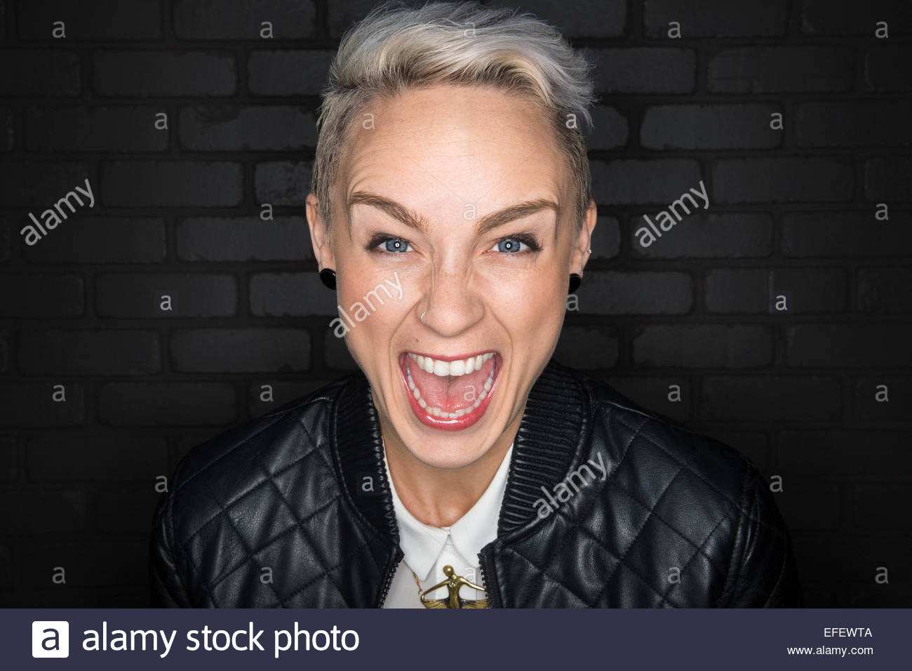 Portrait of screaming blonde woman Stock Photo