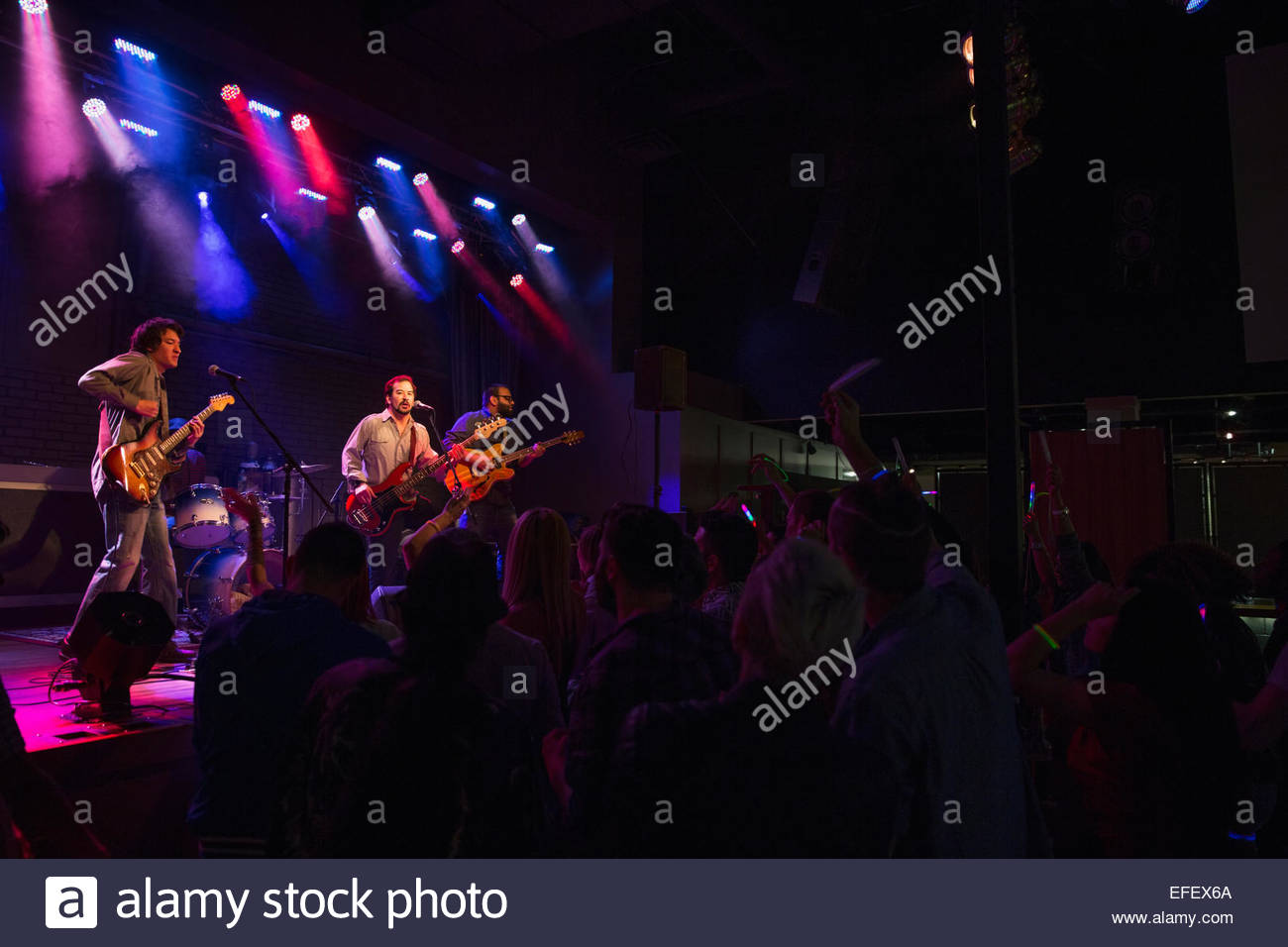 Musical performers on stage at music concert Stock Photo Alamy