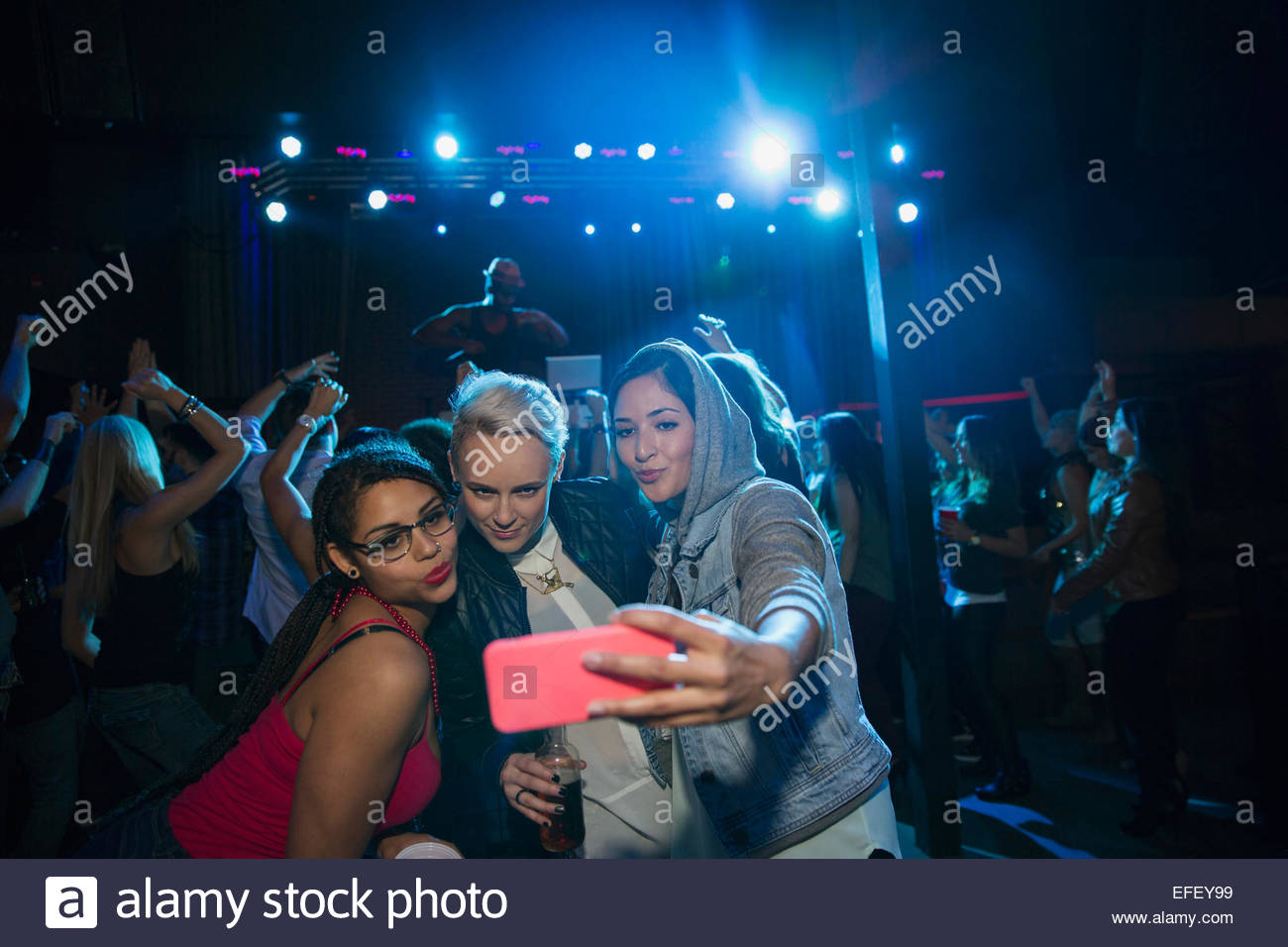 Women taking selfie in nightclub Stock Photo