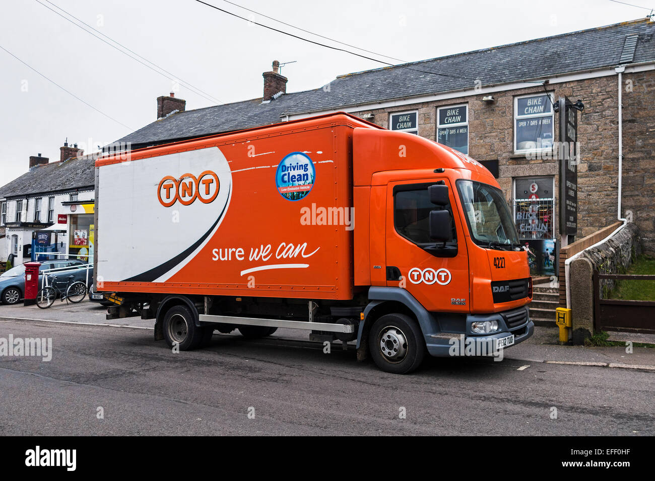 TNT delivery van parked on road Stock Photo