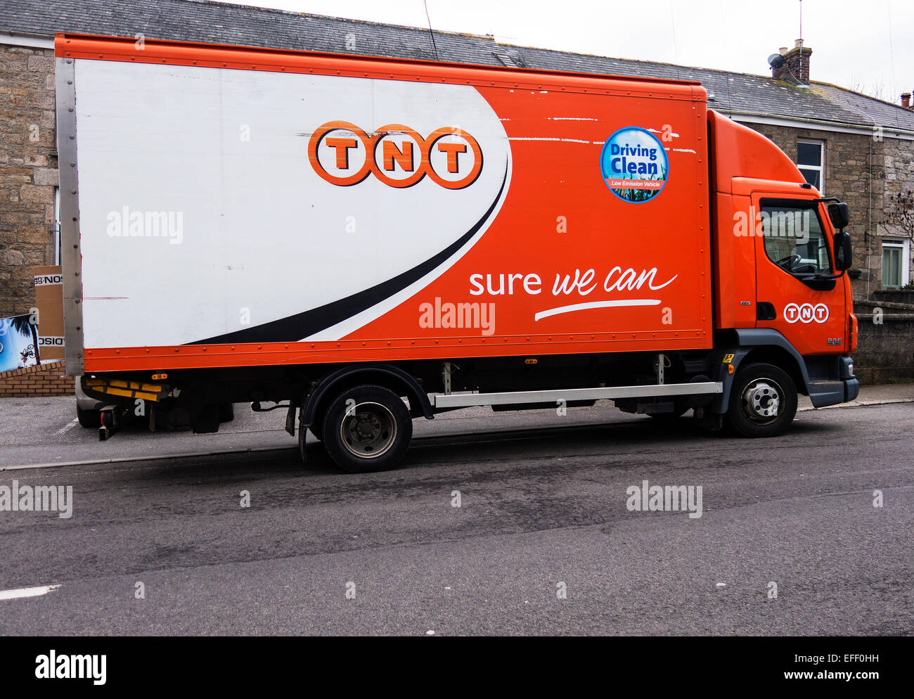 TNT delivery van parked on road Stock Photo