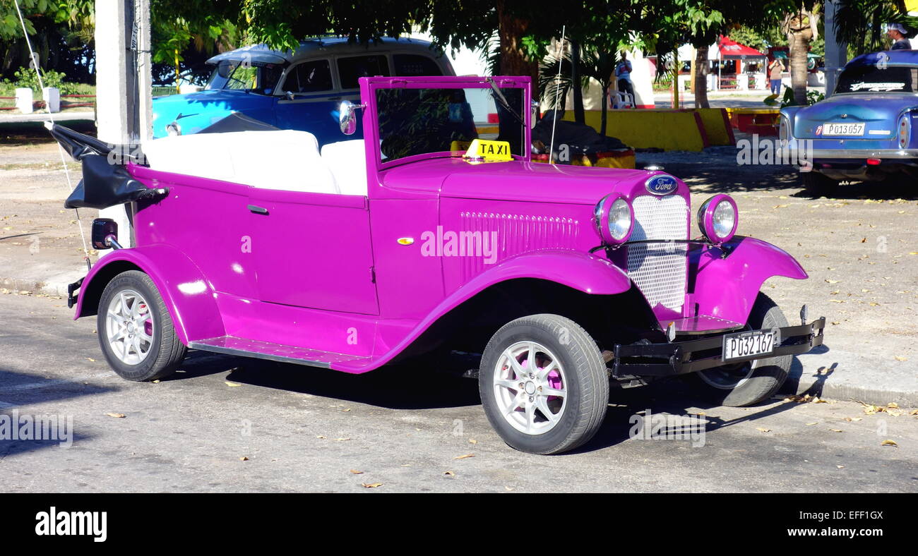 Old purple car in Varadero, Cuba Stock Photo