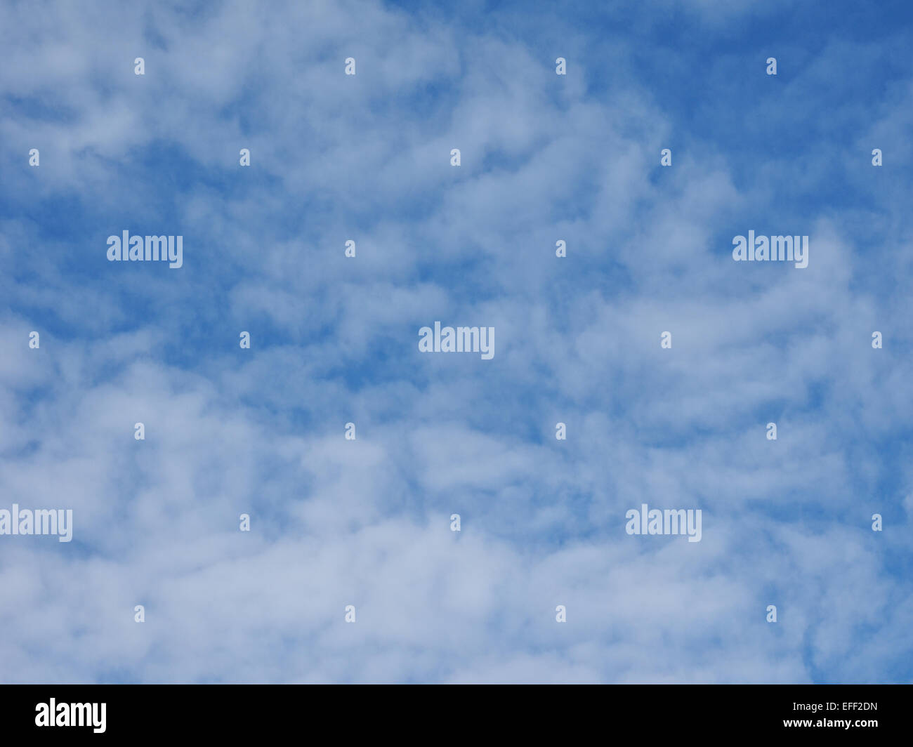Blue sky with clouds useful as a background Stock Photo - Alamy