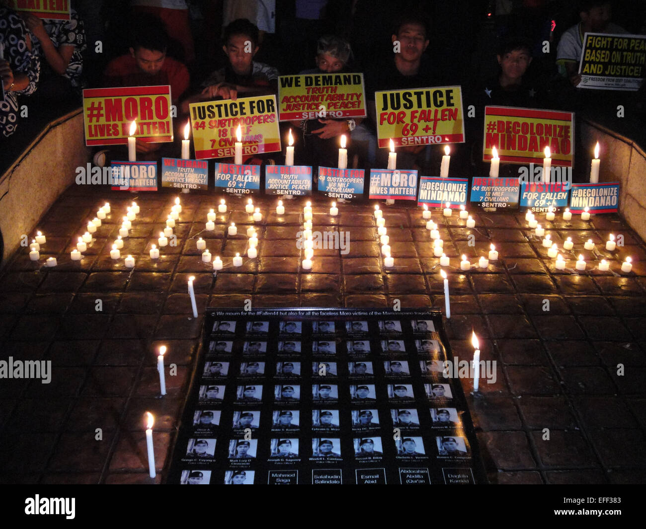 The word 'justice' forms above portraits of those slain in a botched anti-terror operation at the Boy Scout Memorial Circle. Protesters called on the government to investigate the circumstances surrounding the botched anti-terror operation that resulted in the deaths of 44 elite police commandos, as well as civilians affected in the encounter. © Richard James Mendoza/Pacific Press/Alamy Live News Stock Photo
