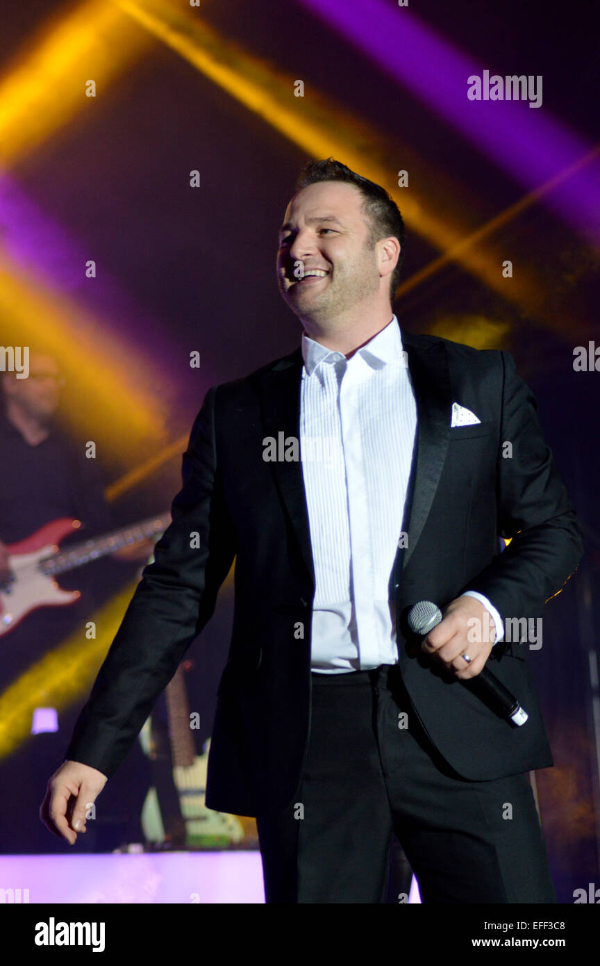 Boyzone performing live on stage at Epsom Live concert at Epsom Downs Racecourse  Featuring: Mikey Graham,Boyzone Where: Epsom, United Kingdom When: 31 Jul 2014 Stock Photo