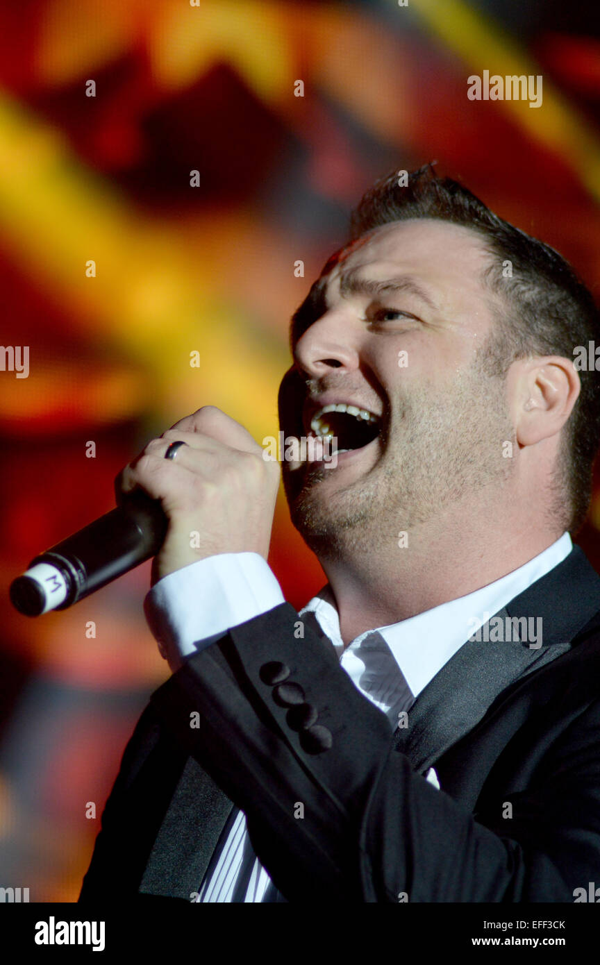 Boyzone performing live on stage at Epsom Live concert at Epsom Downs Racecourse  Featuring: Mikey Graham,Boyzone Where: Epsom, United Kingdom When: 31 Jul 2014 Stock Photo