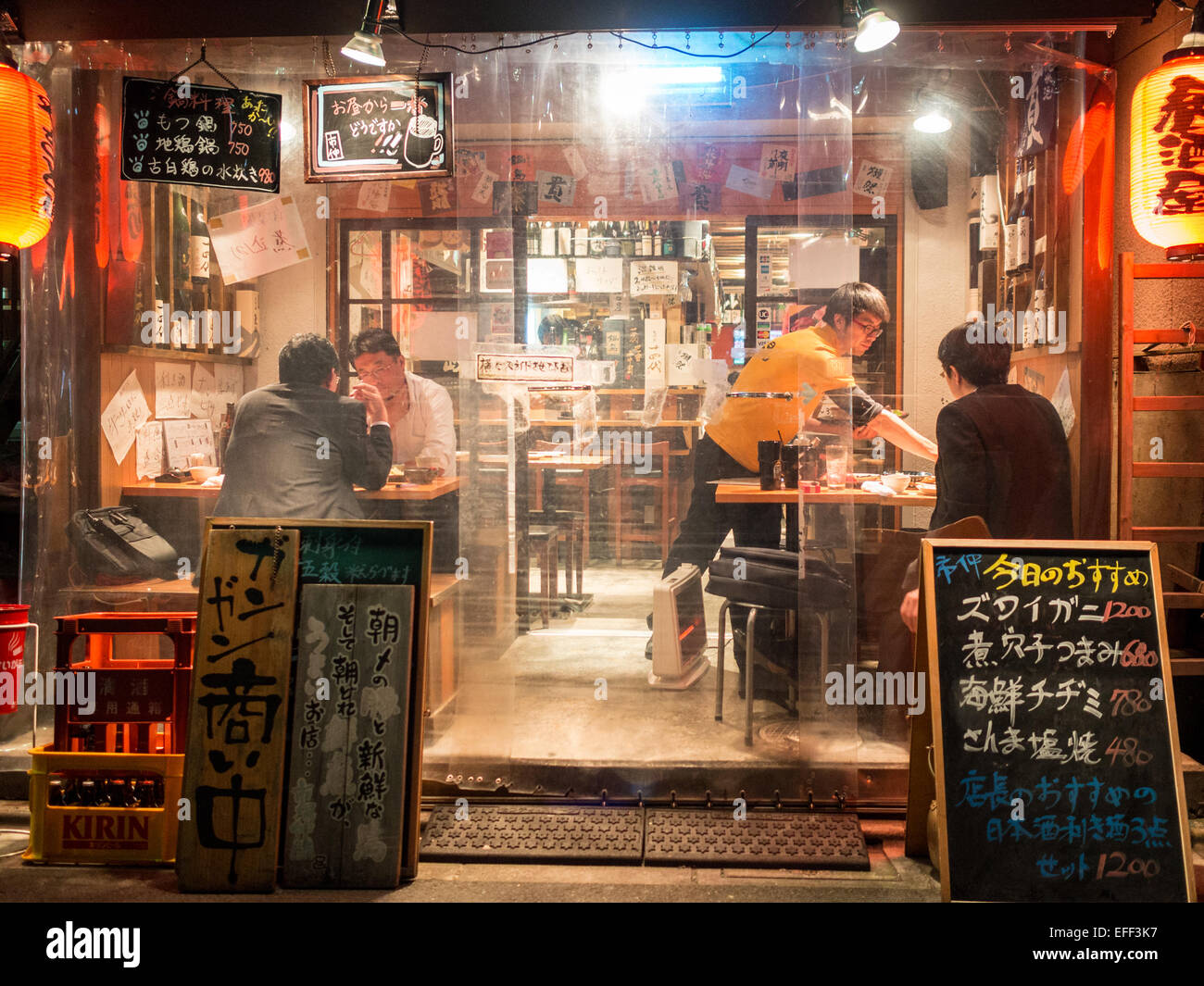 People having dinner in a small terrace of a Shinjuku restaurant Stock Photo