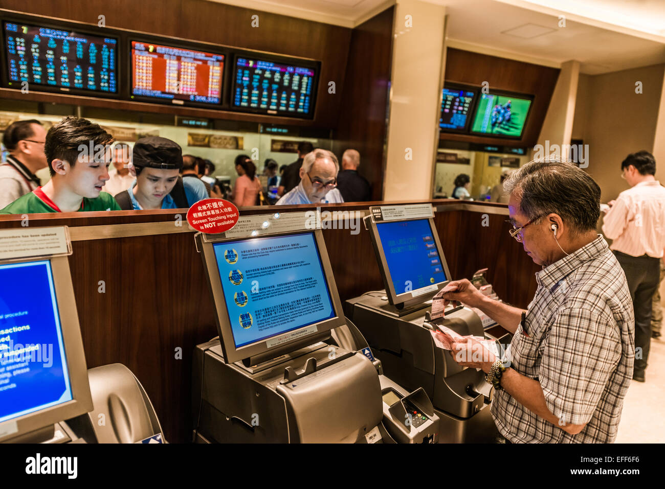 Happy Valley, Hong Kong, China- June 5, 2014: people betting horse races at Happy Valley racecourse Stock Photo