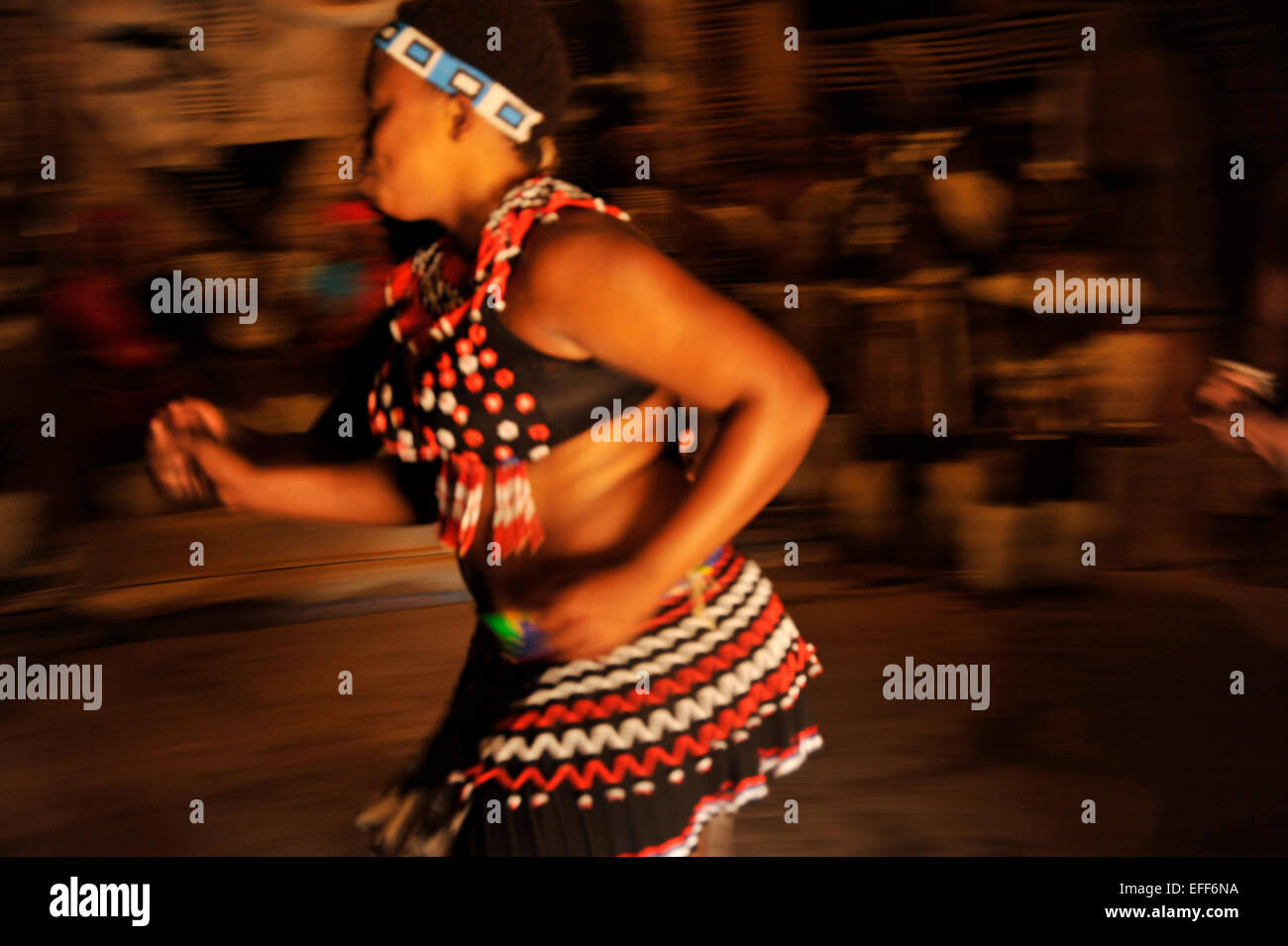 People, adult woman, culture, ethnic, KwaZulu-Natal, South Africa, motion blur, Zulu dancer, traditional dance, Shakaland theme village, action Stock Photo