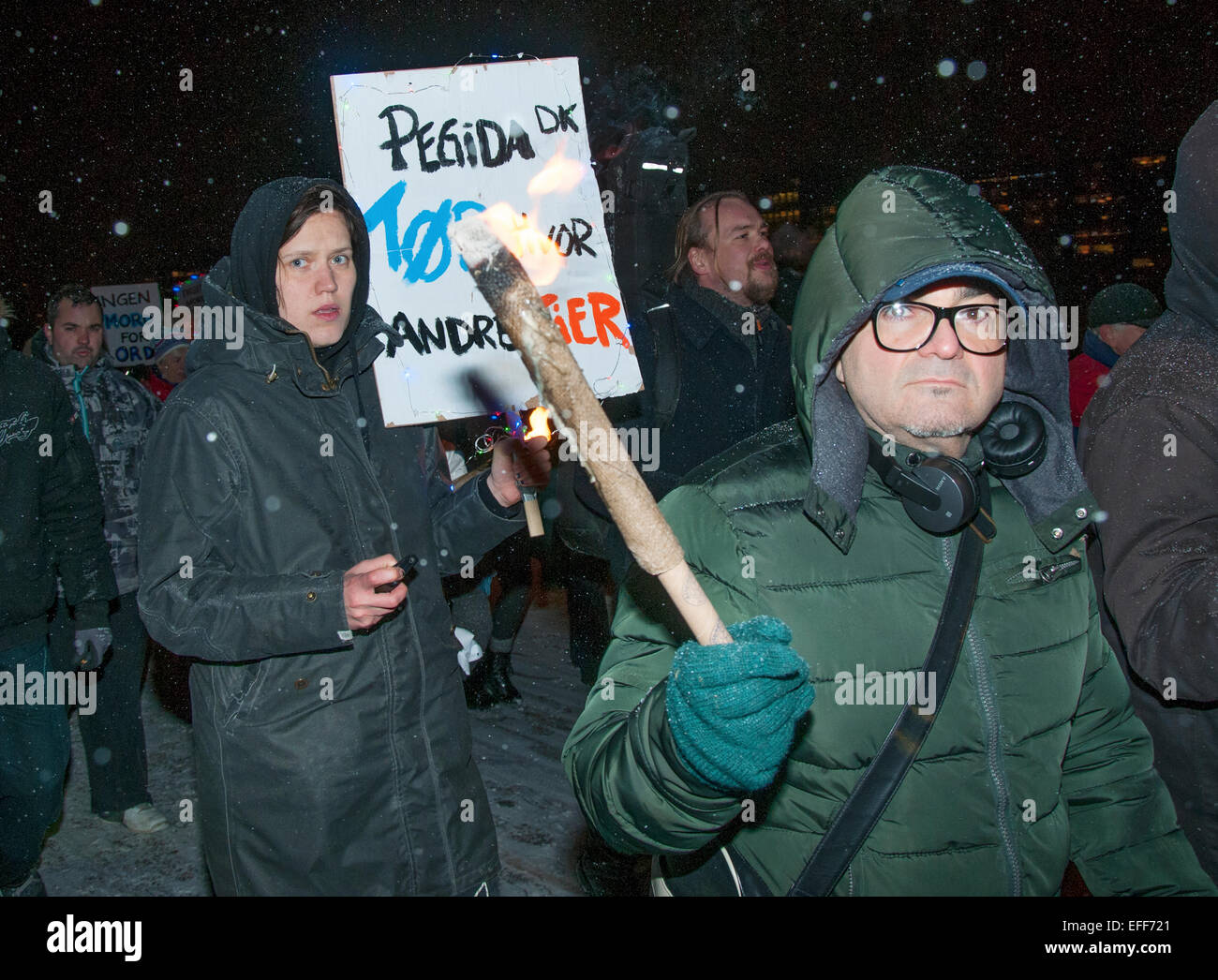 Danish activists brandishing torches took to the streets of Copenhagen on February 2nd 2015 marching against radical Islam. Stock Photo