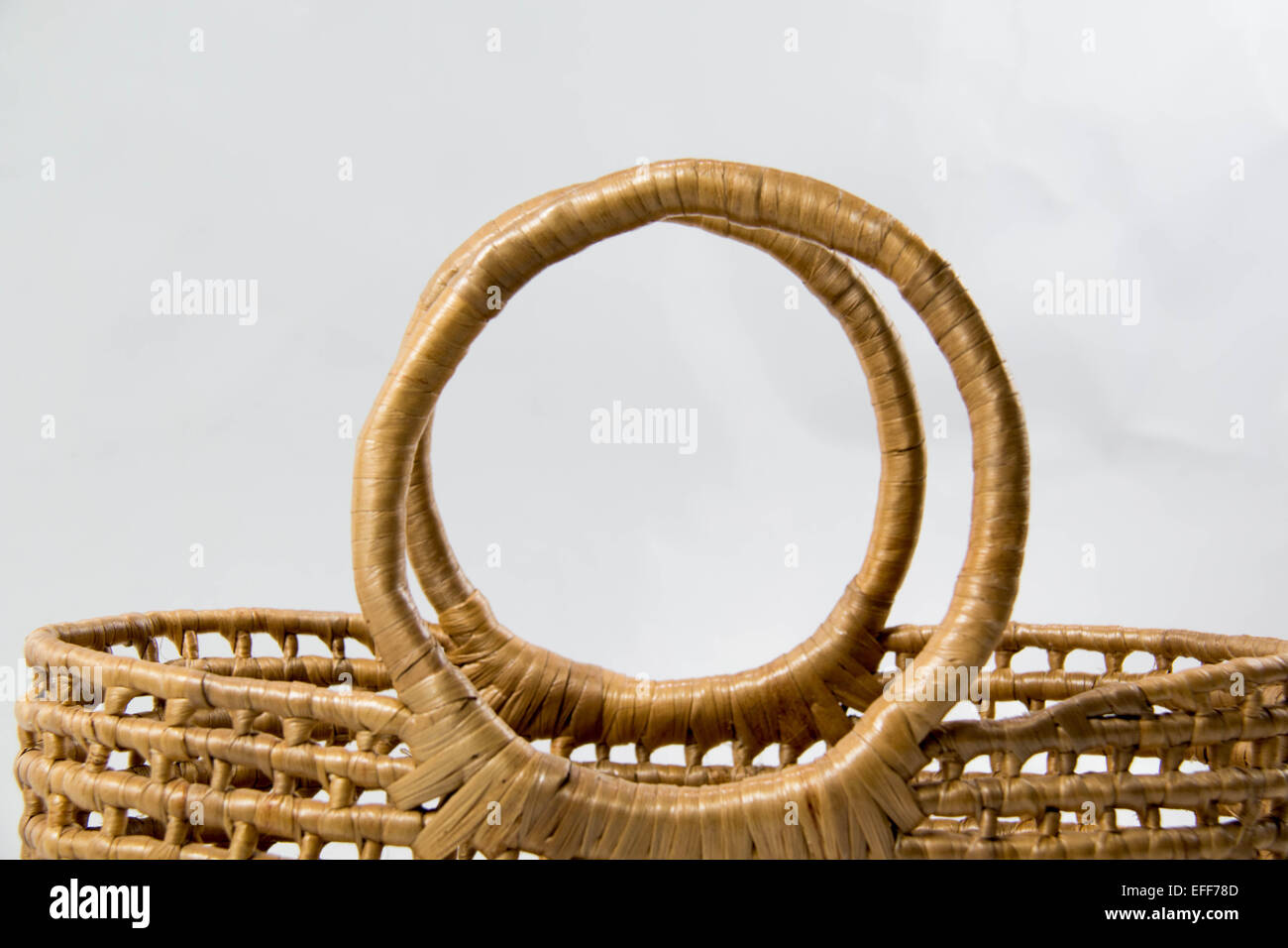 A Wicker basket isolated on white background Stock Photo - Alamy