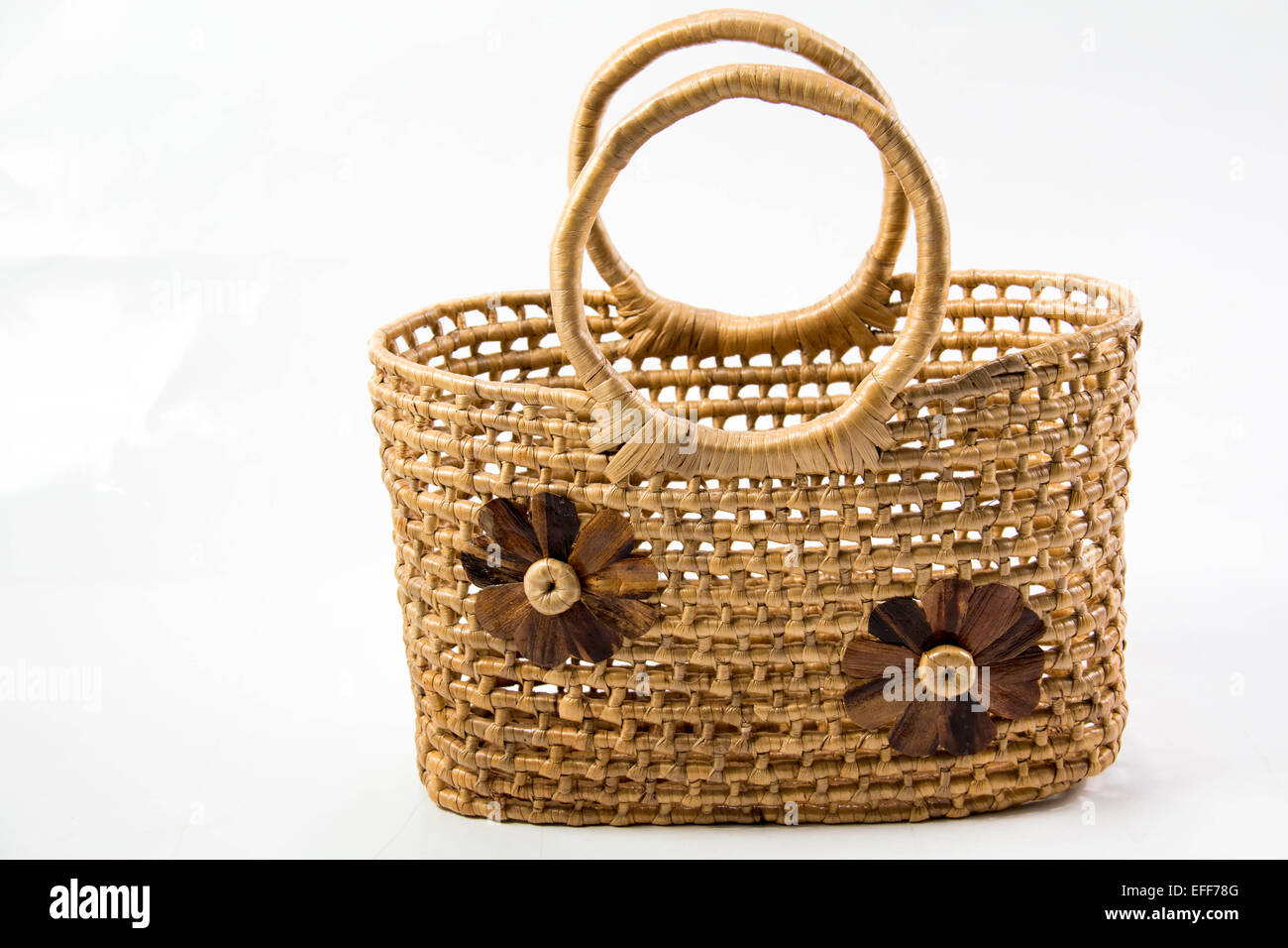 A Wicker basket isolated on white background Stock Photo - Alamy