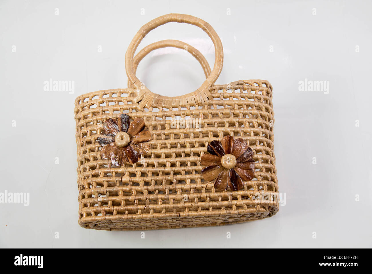 A Wicker basket isolated on white background Stock Photo - Alamy