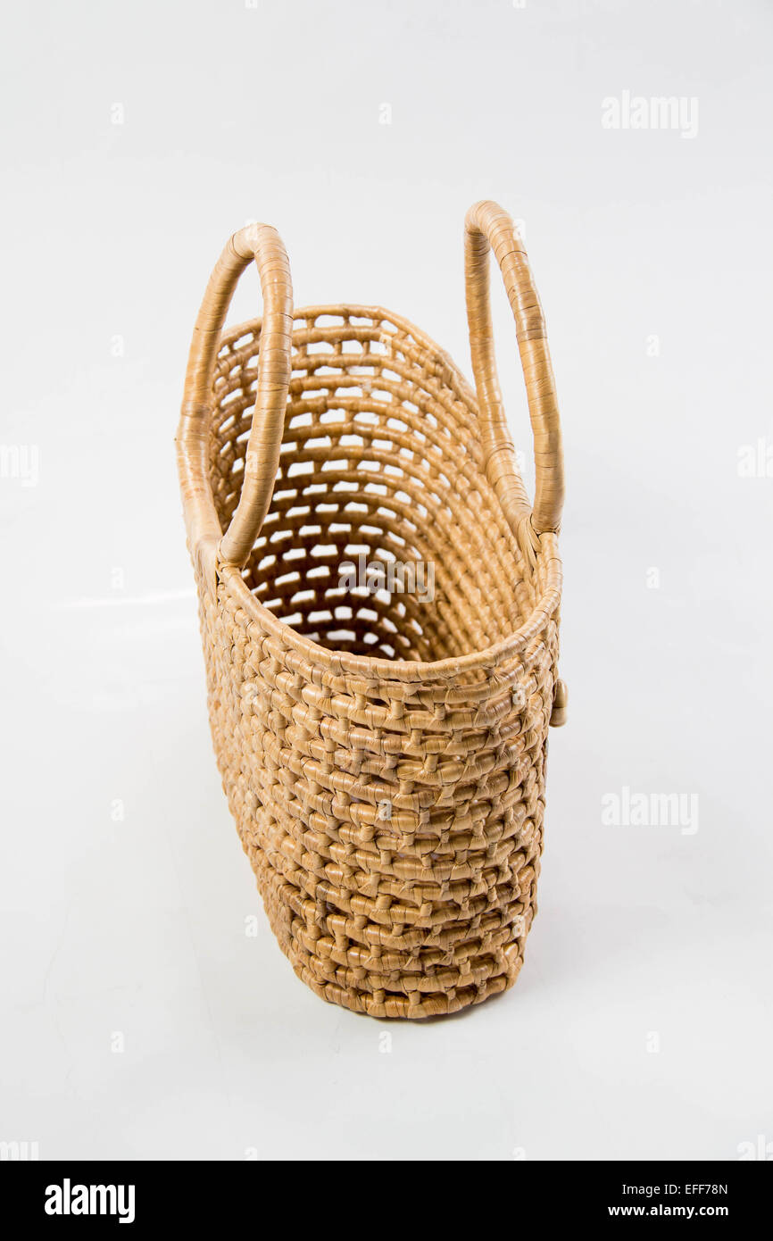 A Wicker basket isolated on white background Stock Photo - Alamy