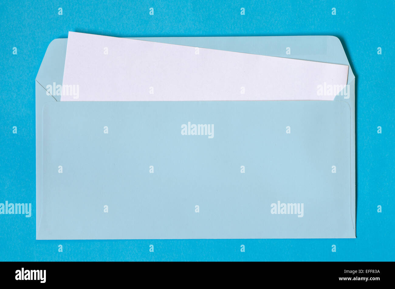 open blue envelope with  blank paper on blue background Stock Photo