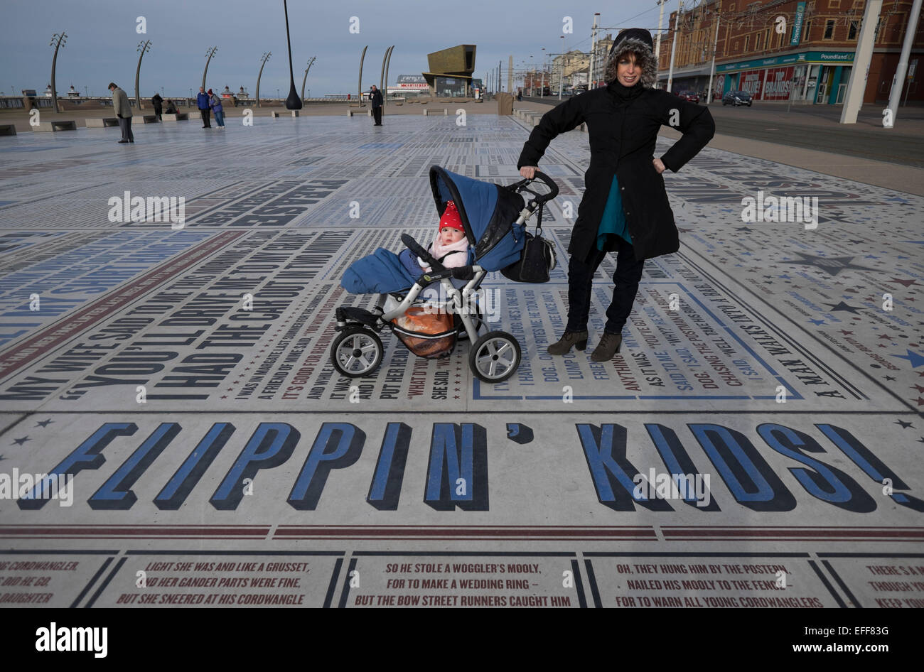 Blackpool comedy carpet front mother pushing pram. credit: LEE RAMSDEN / ALAMY Stock Photo