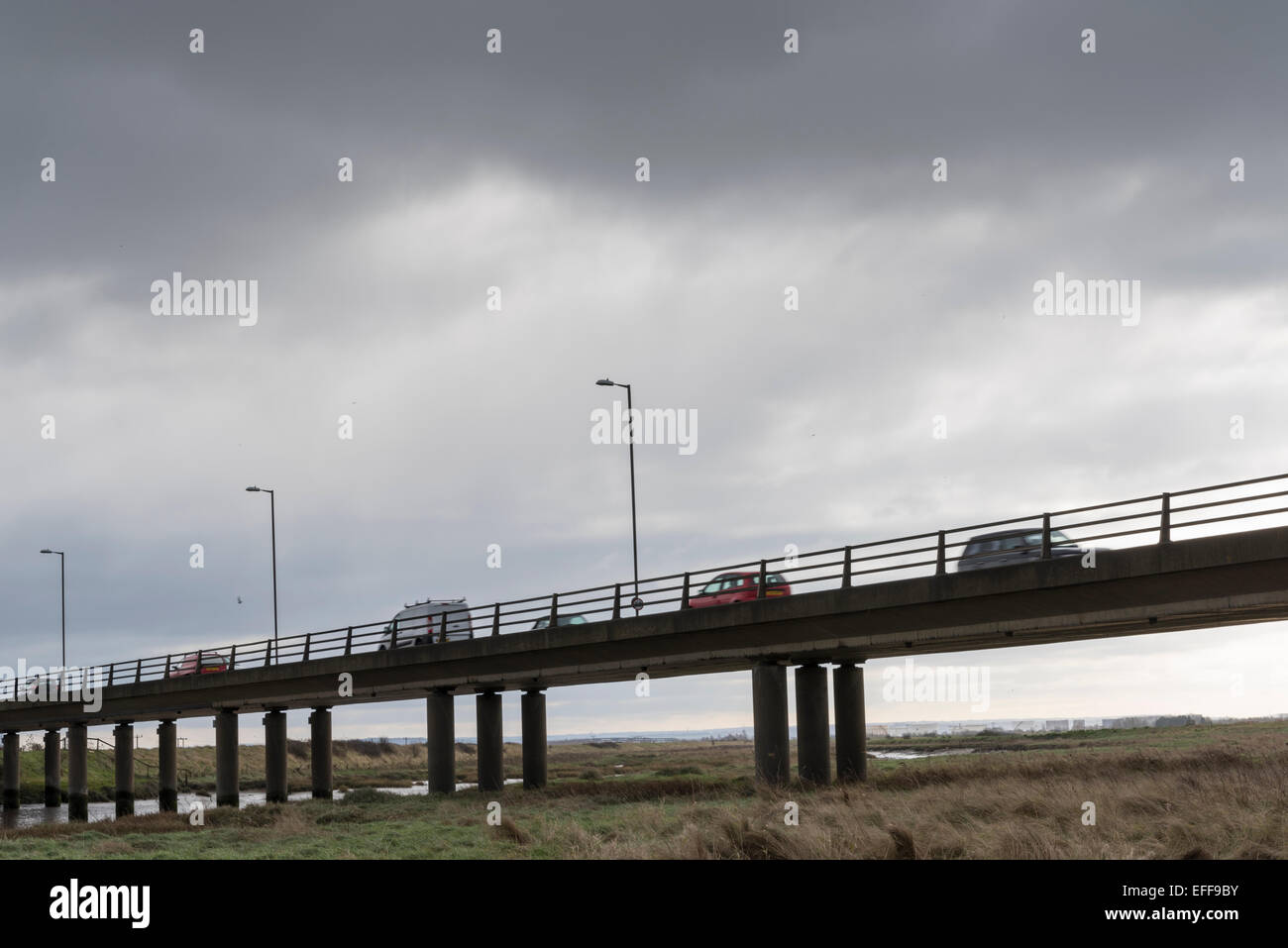 A concrete road bridge across East Haven at Benfleet, Essex.  The road is the A130, the Canvey Way. Stock Photo