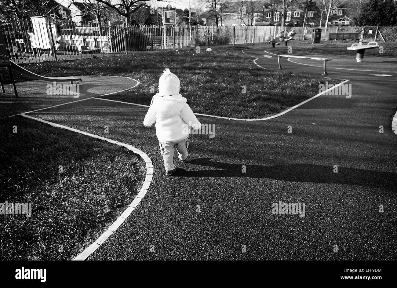 Toddler playing in Ansdell, Lytham St Annes Lansdowne council community park.  credit: LEE RAMSDEN / ALAMY Stock Photo