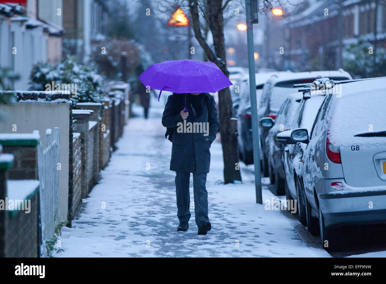 South London, UK. 03rd Feb, 2015. Picture shows an early morning commuter making his way along a snow laden street in Wimbledon, South Wimbledon, where there has been snow showers across parts of London. Credit:  Jeff Gilbert/Alamy Live News Stock Photo