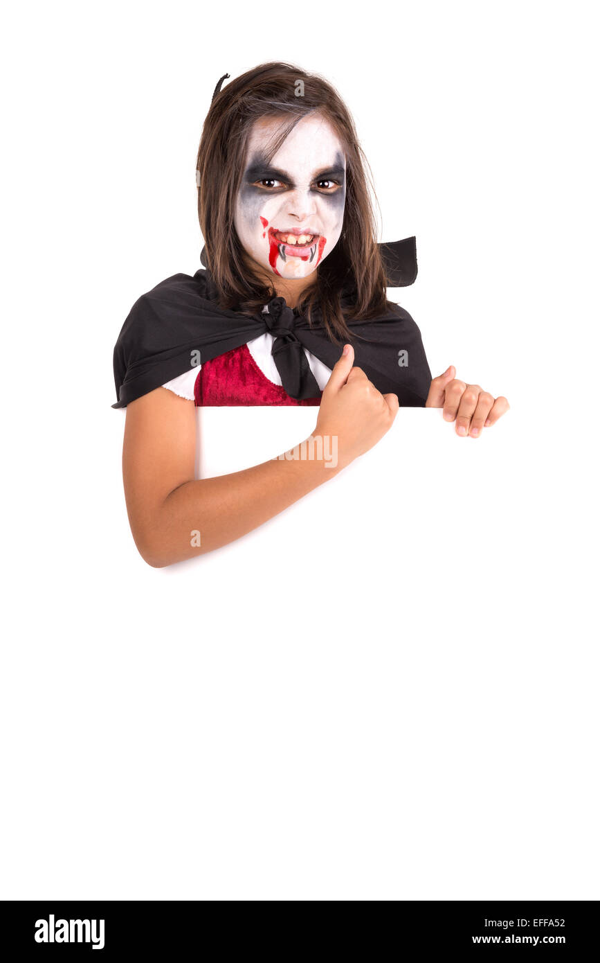 Girl with face-paint and Halloween vampire costume over a white board ...