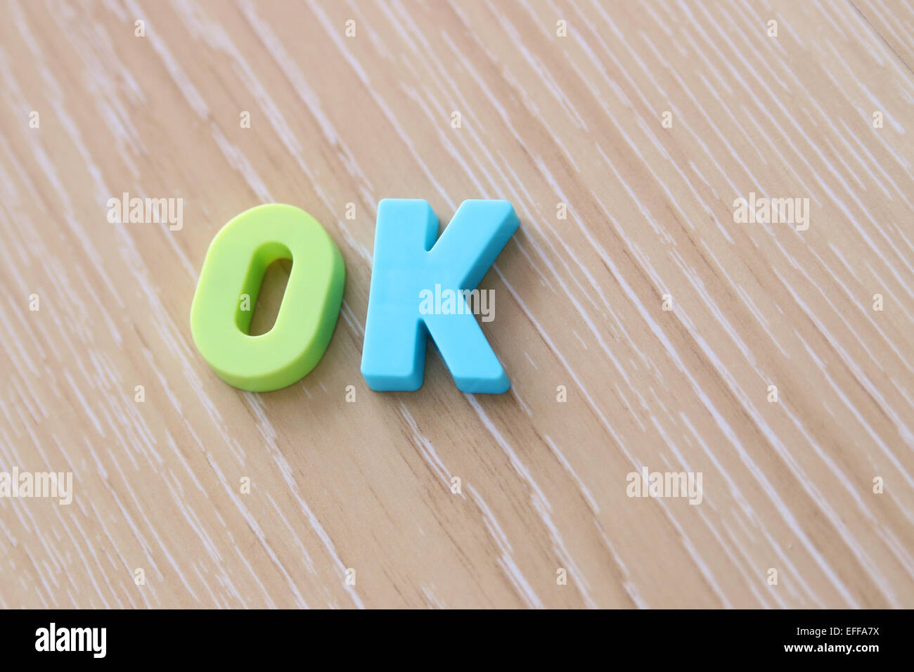 OK spelled using Magnetic Uppercase Letters Stock Photo