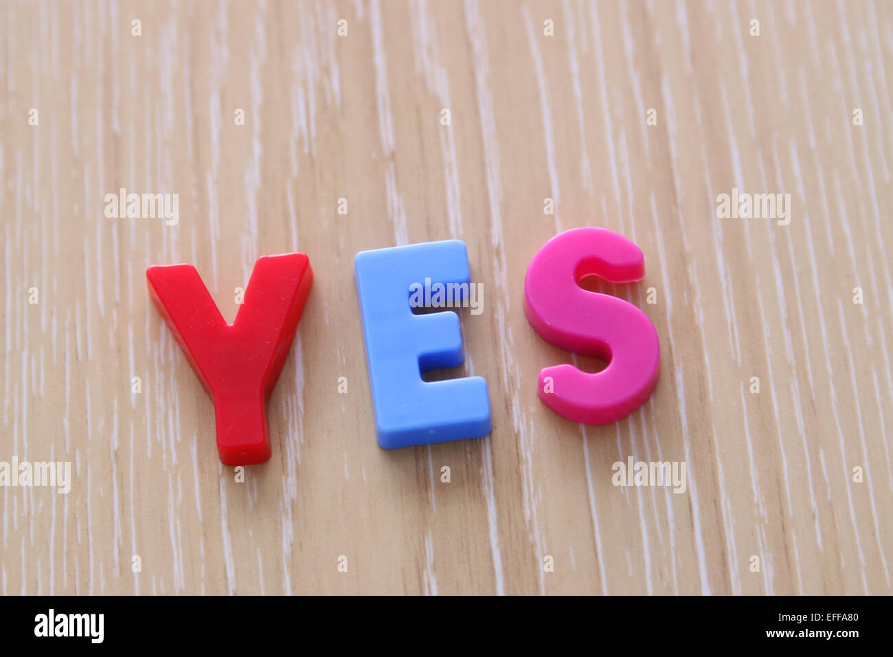 YES spelled using Magnetic Uppercase Letters Stock Photo