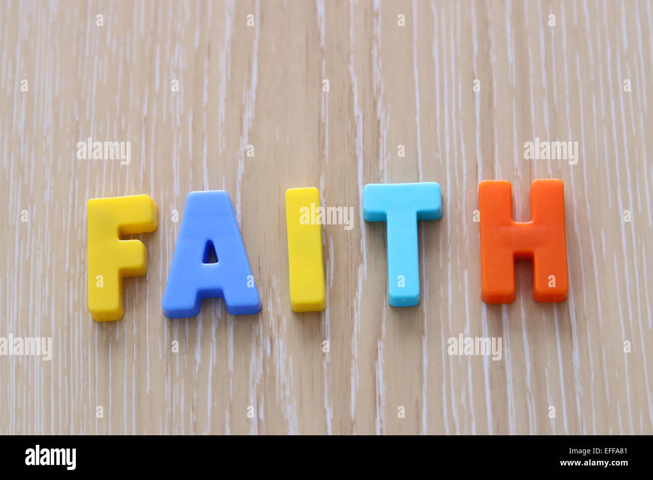 Faith spelled using Magnetic Uppercase Letters Stock Photo