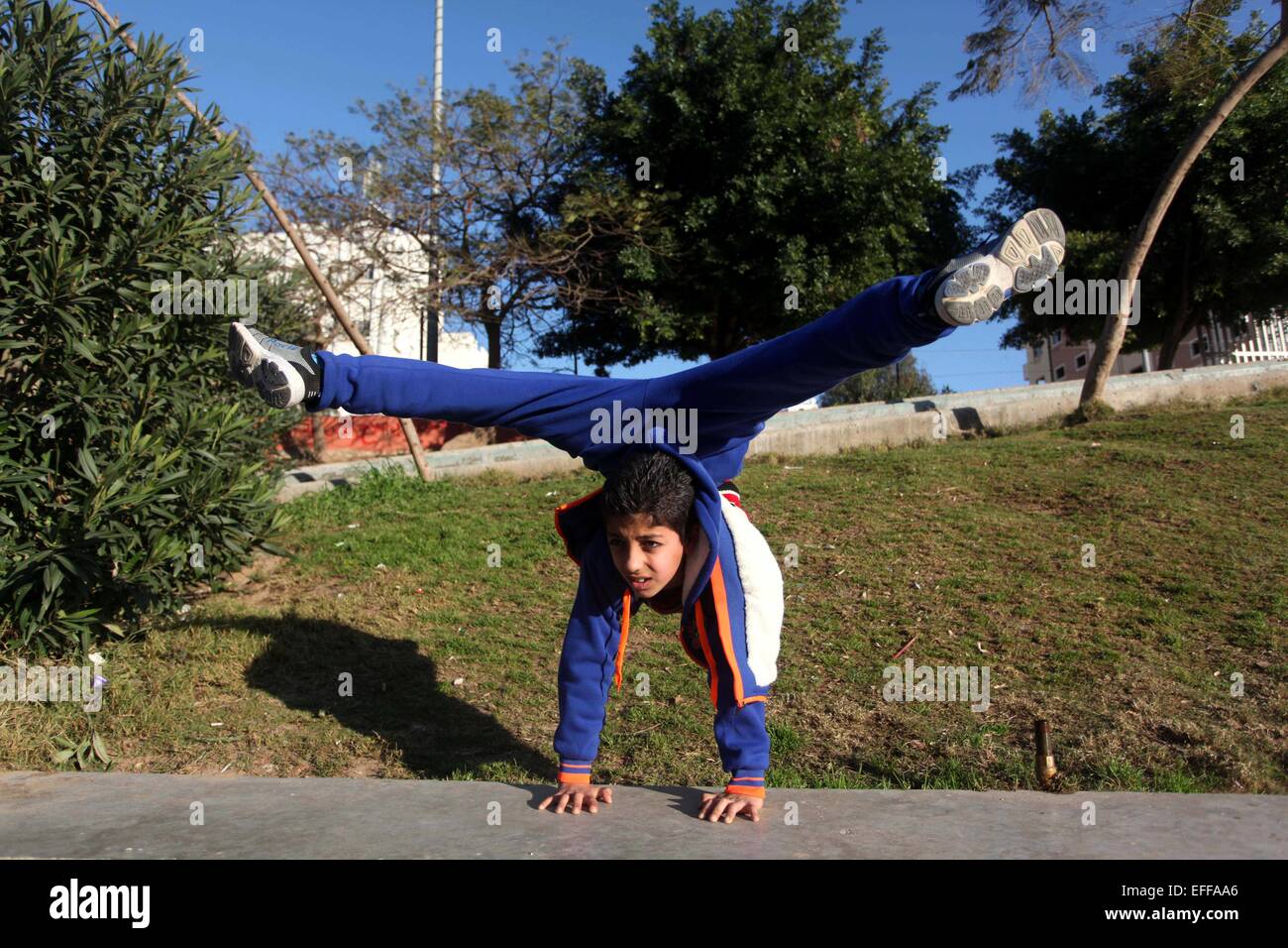 Gaza City, Gaza Strip, Palestinian Territory. 3rd Feb, 2015. Mohammed El-sheikh, a 11-year-old Palestinian boy, demonstrates his skills at a garden, in Gaza city on February 3, 2015. El-sheikh is a extremely flexible young, who's been training for only a year without any professional help, hoping to be an Arab talent after his success in experiments in the hugely popular ''Arabs Got Talent'' TV show in Beirut last month © Ashraf Amra/APA Images/ZUMA Wire/Alamy Live News Stock Photo