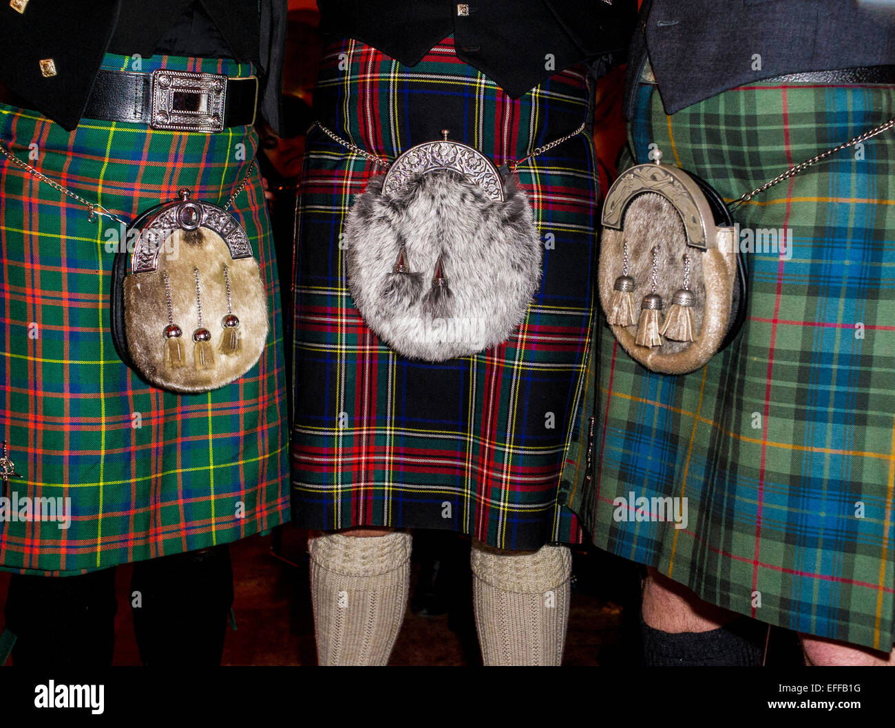 Kilts - Traditional Scottish dress worn at a Burns Night celebration. Stock Photo